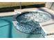 Relax in this lovely spa, featuring blue tile and bubbling water at 384 Orange Cosmos Blvd, Davenport, FL 33837
