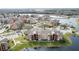 Aerial view of apartment community by lake with green space at 4105 Tropical Isle Blvd # 216, Kissimmee, FL 34741