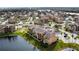Aerial view showcasing community and lake at 4105 Tropical Isle Blvd # 216, Kissimmee, FL 34741