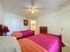 Bedroom with two twin beds and access to bathroom at 4105 Tropical Isle Blvd # 216, Kissimmee, FL 34741