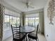 Cozy dining area with a table for four, overlooking a lake at 4105 Tropical Isle Blvd # 216, Kissimmee, FL 34741