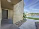 Exterior view of condo building with lake access at 4105 Tropical Isle Blvd # 216, Kissimmee, FL 34741