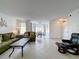 Open concept living and dining area with tile floors at 4105 Tropical Isle Blvd # 216, Kissimmee, FL 34741