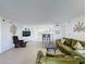 Spacious living room with comfy seating and kitchen views at 4105 Tropical Isle Blvd # 216, Kissimmee, FL 34741