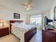 Main bedroom with a ceiling fan and lake view at 4105 Tropical Isle Blvd # 216, Kissimmee, FL 34741