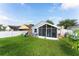 Fenced backyard with screened porch, shed, and playset at 435 Madina Cir, Davenport, FL 33837