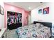 Bedroom with pink walls, two beds and a large closet at 435 Madina Cir, Davenport, FL 33837