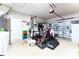 Garage with home gym, storage, and laundry area at 435 Madina Cir, Davenport, FL 33837