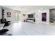 Bright living room with hardwood floors and access to patio at 435 Madina Cir, Davenport, FL 33837
