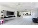 Spacious living room with an open-concept layout, connecting the kitchen and dining areas at 435 Madina Cir, Davenport, FL 33837