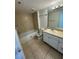 Clean bathroom with white vanity, tub, and toilet at 4518 Commander Dr # 1918, Orlando, FL 32822