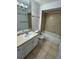 Clean bathroom with white vanity, tub, and toilet at 4518 Commander Dr # 1918, Orlando, FL 32822