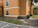 Exterior view of condo building, showcasing building and landscaping at 4518 Commander Dr # 1918, Orlando, FL 32822