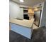Condo kitchen with stainless steel appliances and light cabinets at 4518 Commander Dr # 1918, Orlando, FL 32822