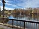 Community lake with fountain and surrounding buildings at 4518 Commander Dr # 1918, Orlando, FL 32822