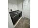 Laundry room with washer, dryer, and shelving at 4518 Commander Dr # 1918, Orlando, FL 32822