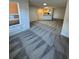 Spacious living room featuring gray patterned carpet at 4518 Commander Dr # 1918, Orlando, FL 32822