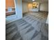 Spacious living room featuring gray patterned carpet at 4518 Commander Dr # 1918, Orlando, FL 32822