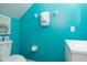 Small bathroom with teal walls and white vanity at 4608 Cumbrian Lakes Dr, Kissimmee, FL 34746