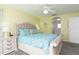 Main bedroom with a king-size bed and ensuite bathroom at 4608 Cumbrian Lakes Dr, Kissimmee, FL 34746