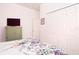 Bedroom with green armoire and floral bedding at 4608 Cumbrian Lakes Dr, Kissimmee, FL 34746