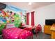 ' bedroom with twin beds and Minnie Mouse mural at 4608 Cumbrian Lakes Dr, Kissimmee, FL 34746