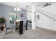 Modern dining area with glass table and open concept view at 4608 Cumbrian Lakes Dr, Kissimmee, FL 34746