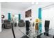 Casual dining area with glass table and comfy armchairs at 4608 Cumbrian Lakes Dr, Kissimmee, FL 34746