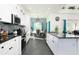 Modern kitchen with white cabinets, granite counters, and breakfast area at 4608 Cumbrian Lakes Dr, Kissimmee, FL 34746