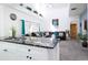 Open kitchen with granite island and modern white cabinets at 4608 Cumbrian Lakes Dr, Kissimmee, FL 34746