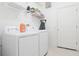 Bright laundry room with washer, dryer, and shelving at 4608 Cumbrian Lakes Dr, Kissimmee, FL 34746