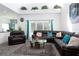 Open concept living room with kitchen and high ceilings at 4608 Cumbrian Lakes Dr, Kissimmee, FL 34746