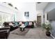Open living area with sectional sofa and view of bathroom at 4608 Cumbrian Lakes Dr, Kissimmee, FL 34746