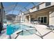 Enclosed pool and spa with patio furniture at 4608 Cumbrian Lakes Dr, Kissimmee, FL 34746