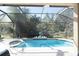 Inviting screened pool area with spa and tranquil landscaping at 4608 Cumbrian Lakes Dr, Kissimmee, FL 34746