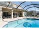 Enclosed pool and spa with patio furniture at 4608 Cumbrian Lakes Dr, Kissimmee, FL 34746