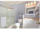 Clean bathroom with a walk-in shower and white vanity at 4724 Vero Beach Pl, Kissimmee, FL 34746