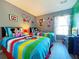 Mickey Mouse-themed bedroom with twin beds at 4724 Vero Beach Pl, Kissimmee, FL 34746