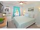 Bedroom with a queen-size bed and coastal decor at 4724 Vero Beach Pl, Kissimmee, FL 34746