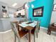 Dining area with table and chairs near kitchen and living room at 4724 Vero Beach Pl, Kissimmee, FL 34746