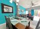 Dining area with table and chairs near kitchen and living room at 4724 Vero Beach Pl, Kissimmee, FL 34746