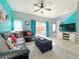 Living room with sectional sofa, TV, and patio access at 4724 Vero Beach Pl, Kissimmee, FL 34746