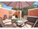 Relaxing patio with hot tub, seating area, and umbrella at 4724 Vero Beach Pl, Kissimmee, FL 34746