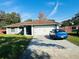 One-story house with a gray exterior, attached garage, and a well-maintained lawn at 500 16Th St, Saint Cloud, FL 34769
