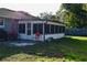 Cozy screened porch with patio furniture, offering a relaxing outdoor space at 500 16Th St, Saint Cloud, FL 34769