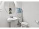 Clean and simple bathroom with pedestal sink and toilet at 5014 E Fountainwood Dr, Saint Cloud, FL 34772
