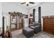 Bright bedroom with wood floors, a ceiling fan, and plenty of natural light at 5014 E Fountainwood Dr, Saint Cloud, FL 34772