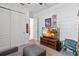 Bedroom with TV, built-in shelving, and comfortable seating at 5014 E Fountainwood Dr, Saint Cloud, FL 34772