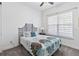 Cozy bedroom with a queen bed and large window at 5014 E Fountainwood Dr, Saint Cloud, FL 34772