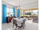 Bright dining room with table, chairs, and view of backyard patio at 5014 E Fountainwood Dr, Saint Cloud, FL 34772